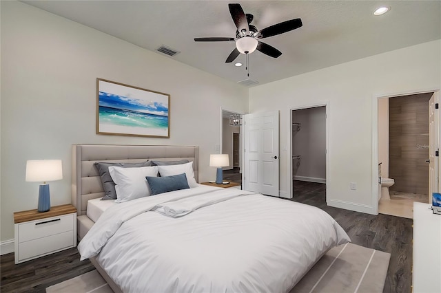 bedroom featuring a walk in closet, ensuite bath, dark hardwood / wood-style flooring, a closet, and ceiling fan