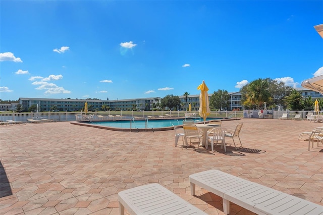 view of swimming pool featuring a patio