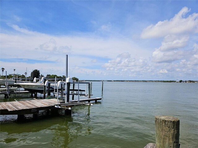 dock area featuring a water view and boat lift