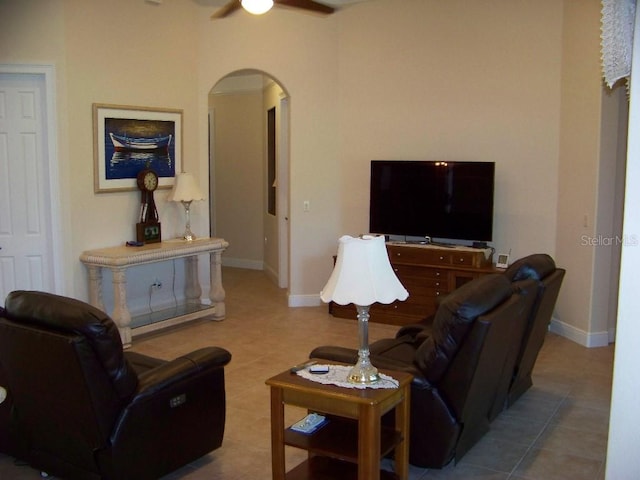 living room with tile patterned floors and ceiling fan