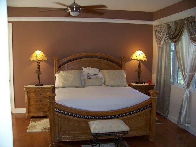 bedroom with ceiling fan and wood-type flooring