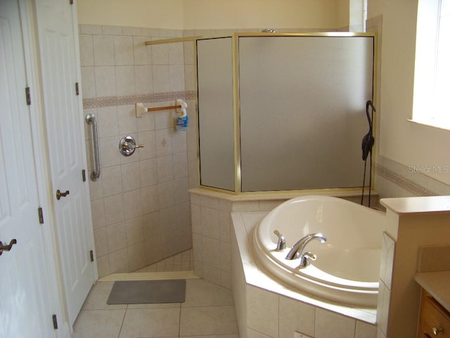 bathroom featuring vanity, separate shower and tub, and tile patterned floors