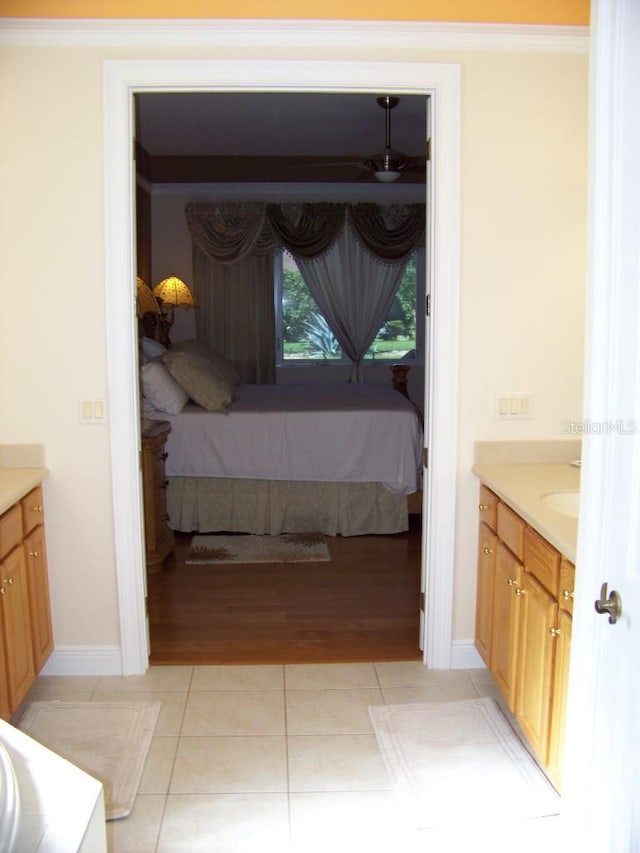 bedroom featuring light hardwood / wood-style flooring and crown molding