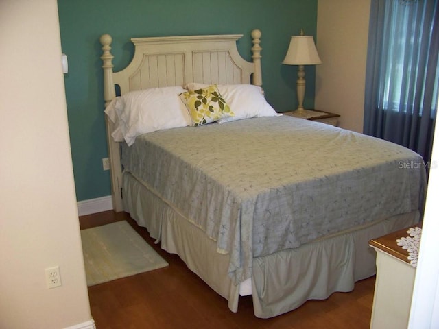 bedroom featuring hardwood / wood-style floors