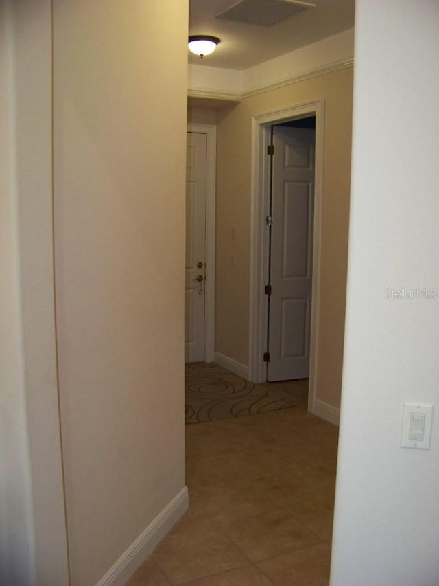 hallway featuring light tile patterned floors