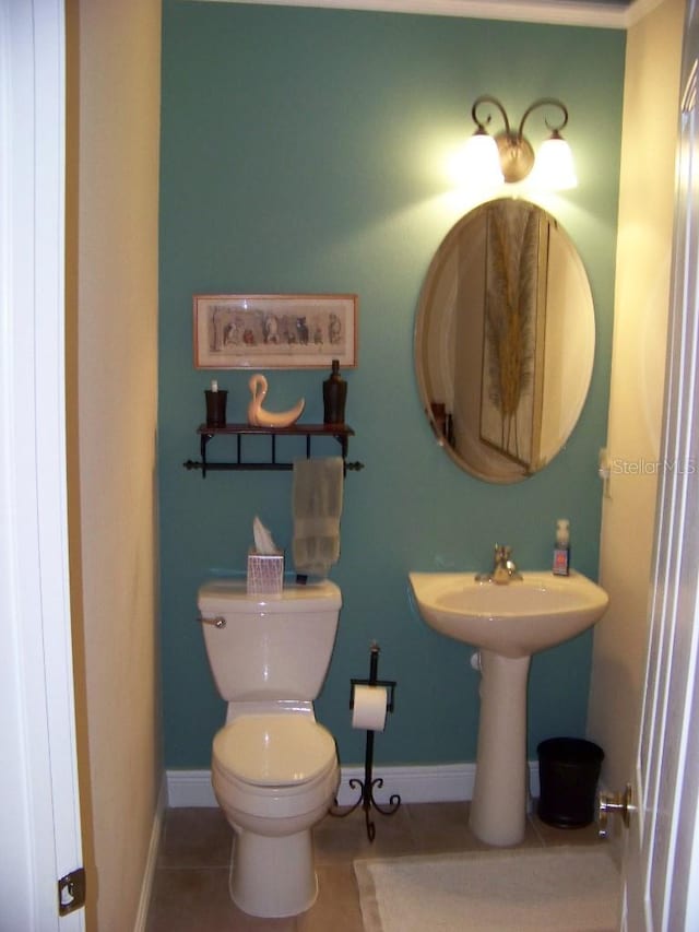 bathroom featuring toilet and tile patterned floors