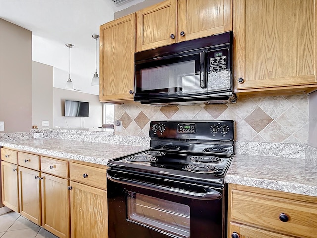 kitchen featuring hanging light fixtures, light tile patterned floors, black appliances, and decorative backsplash