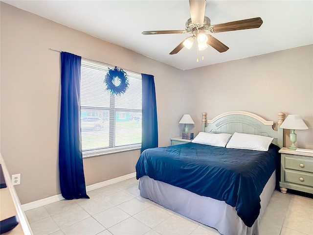 bedroom with light tile patterned floors and ceiling fan