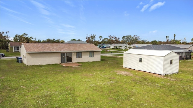 rear view of property with a lawn