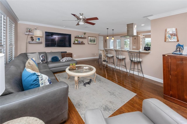 living room featuring crown molding, ceiling fan, and dark hardwood / wood-style flooring