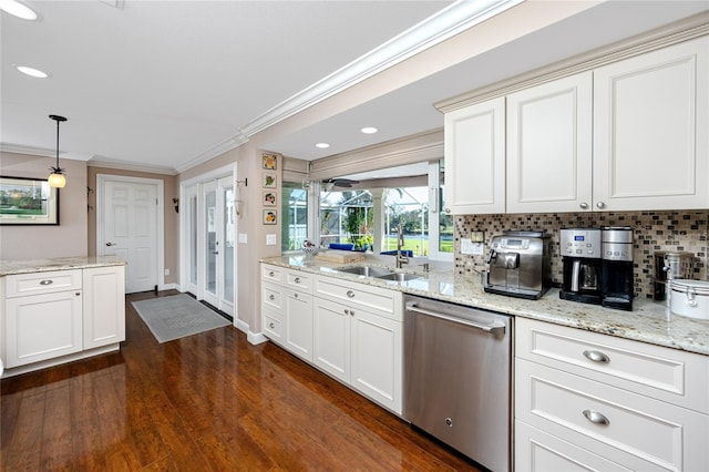 kitchen featuring dishwasher, dark hardwood / wood-style floors, sink, crown molding, and decorative light fixtures