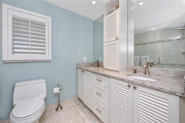 bathroom featuring toilet, an enclosed shower, and vanity