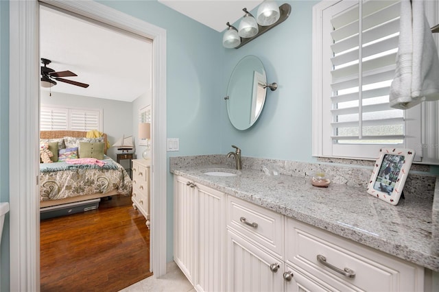 bathroom featuring vanity, ceiling fan, and hardwood / wood-style floors