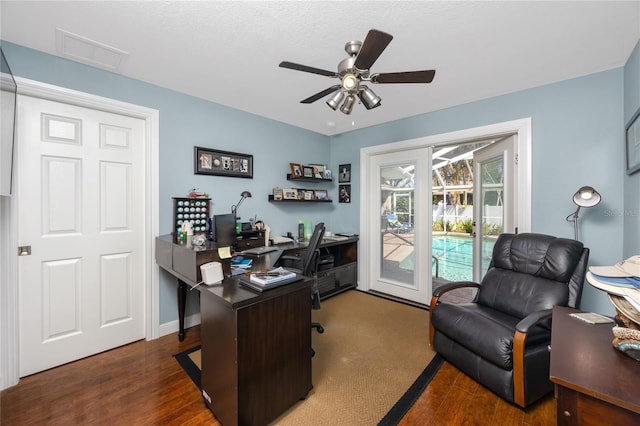 home office featuring ceiling fan and dark hardwood / wood-style floors