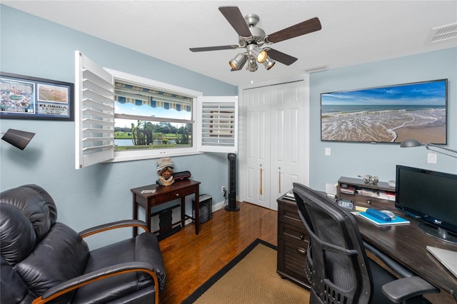 office area featuring dark wood-type flooring and ceiling fan