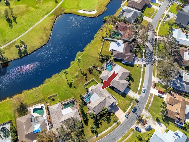 birds eye view of property with a water view