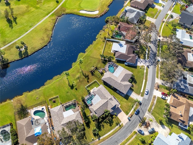 birds eye view of property with a water view