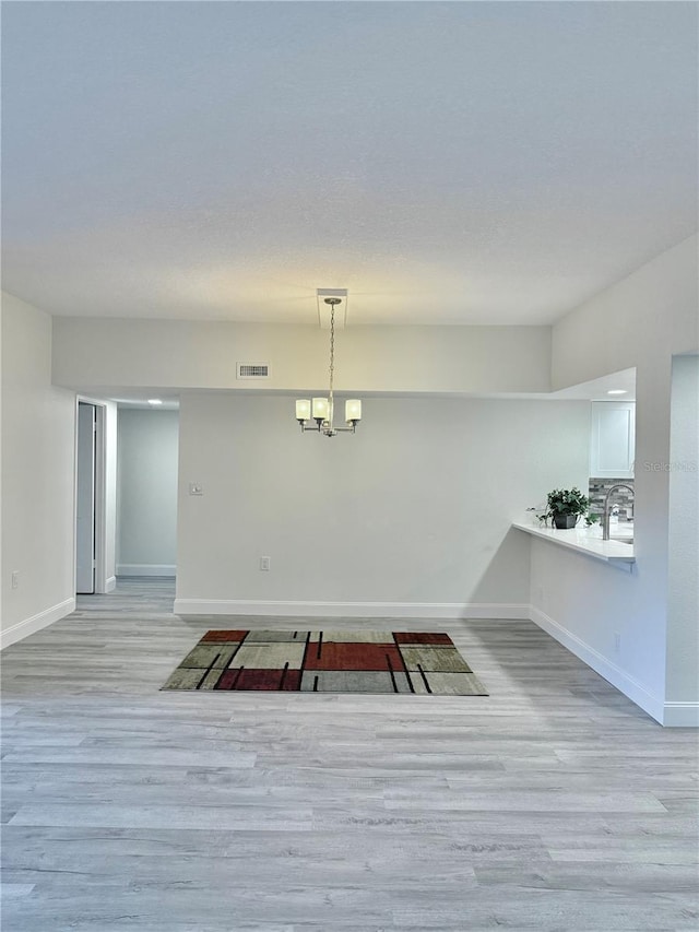 unfurnished dining area featuring light hardwood / wood-style floors