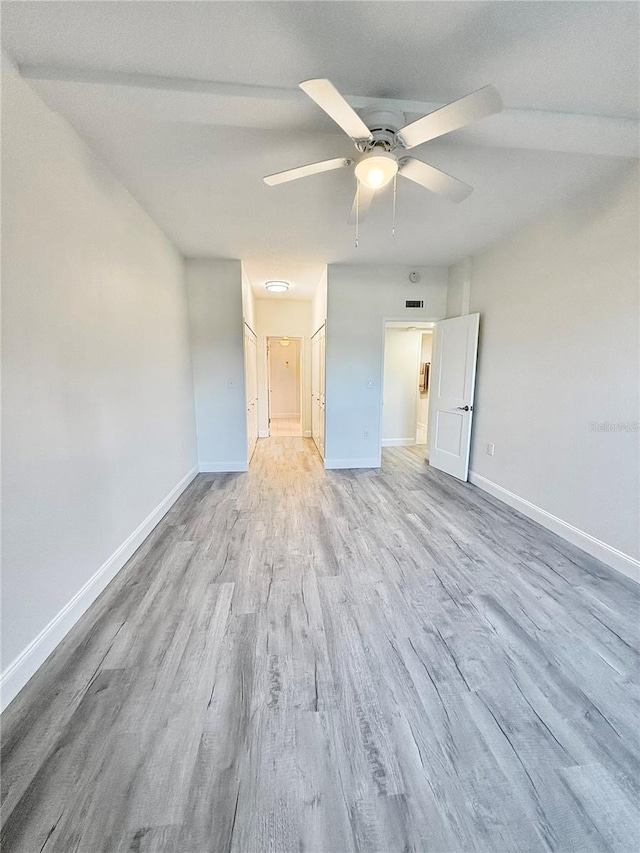 unfurnished bedroom featuring ceiling fan and light hardwood / wood-style flooring