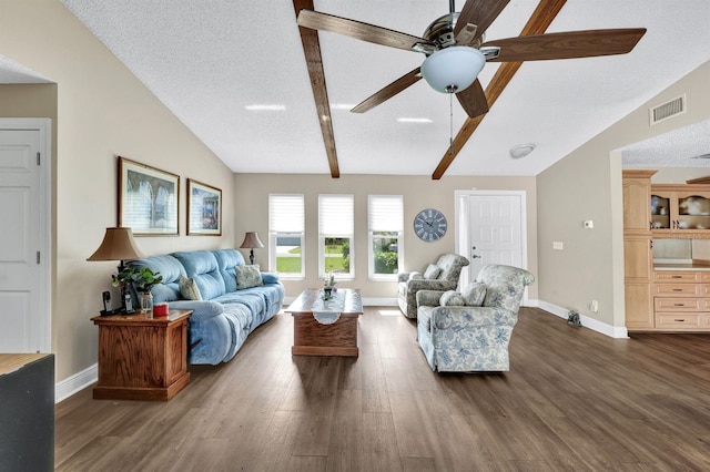 living room with ceiling fan, lofted ceiling with beams, a textured ceiling, and dark hardwood / wood-style flooring