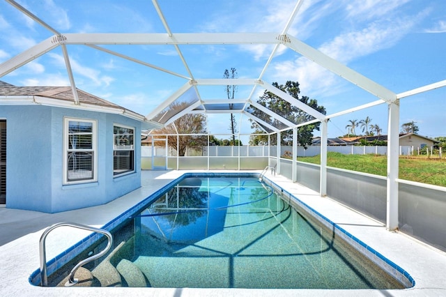 view of pool with a patio and a lanai