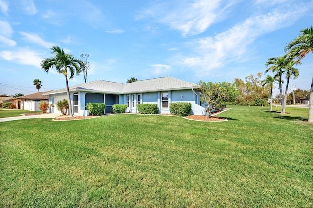 ranch-style home with a front yard and a garage