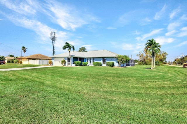 single story home with a front lawn and a garage