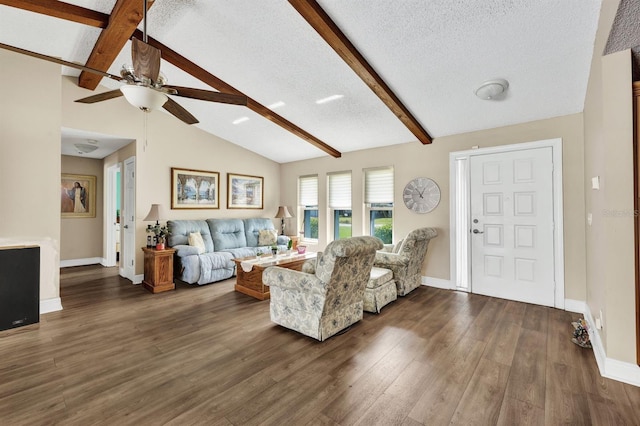 living room featuring vaulted ceiling with beams, dark hardwood / wood-style floors, a textured ceiling, and ceiling fan