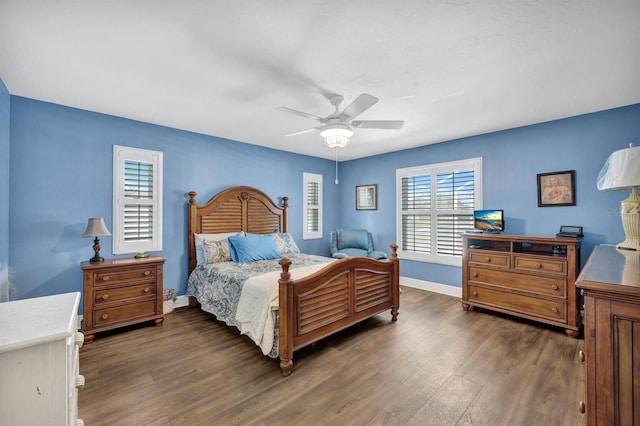 bedroom featuring dark wood-type flooring and ceiling fan