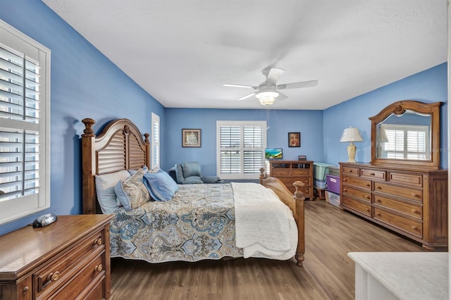 bedroom with hardwood / wood-style floors and ceiling fan