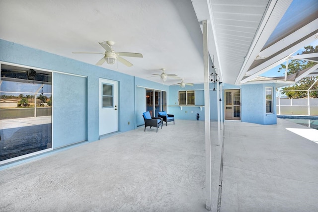 view of patio featuring ceiling fan