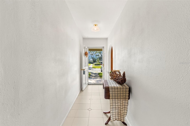 doorway featuring light tile patterned floors