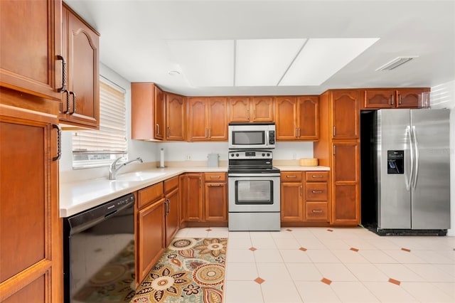 kitchen with sink and appliances with stainless steel finishes