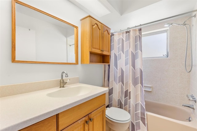 full bathroom featuring vanity, shower / bath combination with curtain, and toilet