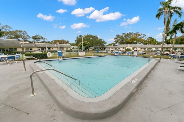 view of swimming pool with a patio area