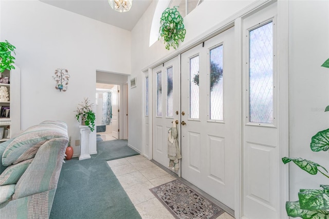 carpeted entrance foyer featuring plenty of natural light