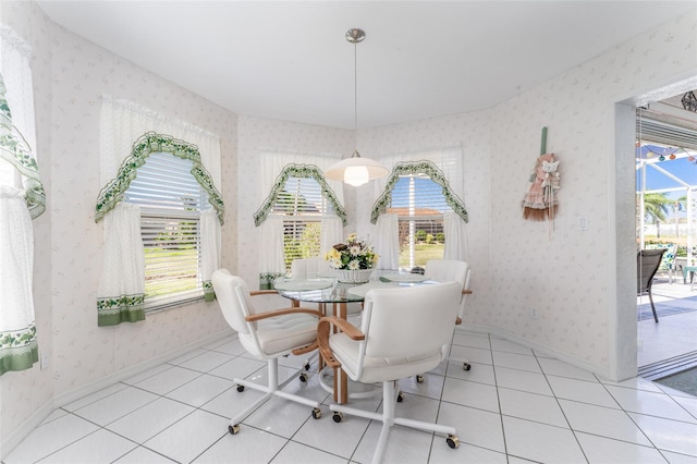 dining room with plenty of natural light and tile patterned flooring