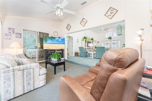 living room with ceiling fan and carpet flooring