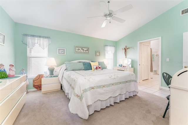 carpeted bedroom with ceiling fan and vaulted ceiling