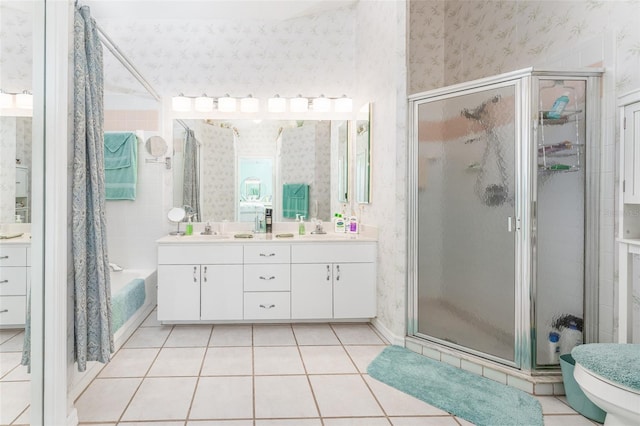 bathroom featuring vanity, plus walk in shower, and tile patterned flooring