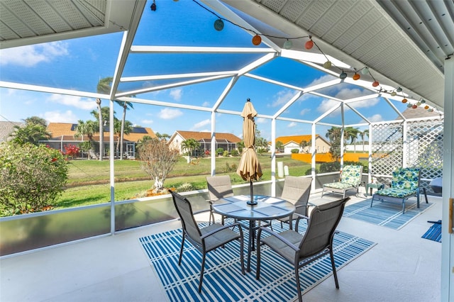 view of patio / terrace featuring glass enclosure