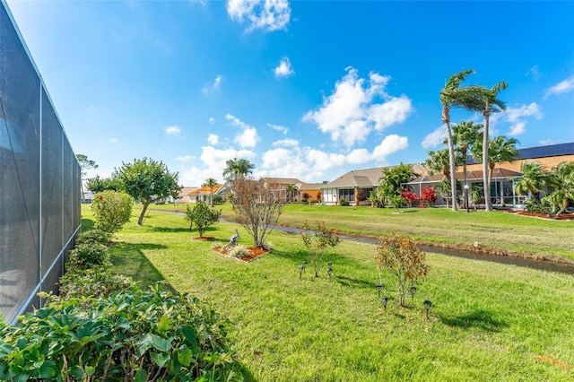 view of yard featuring a lanai