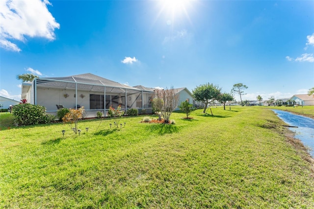 view of yard with a lanai