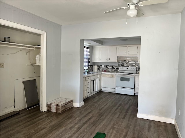 kitchen featuring decorative backsplash, sink, white cabinets, white appliances, and dark hardwood / wood-style flooring