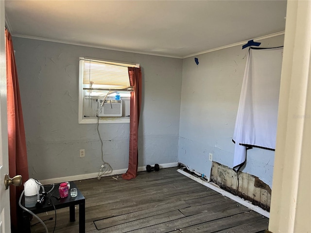 spare room with ornamental molding, cooling unit, and dark hardwood / wood-style flooring