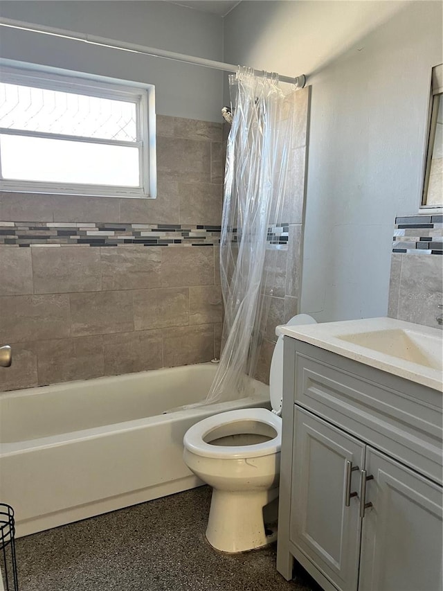 full bathroom with shower / bath combo with shower curtain, vanity, and toilet