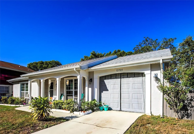 ranch-style home featuring a garage and a porch