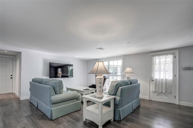 living room featuring dark hardwood / wood-style floors