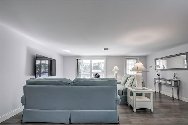 living room featuring dark hardwood / wood-style floors