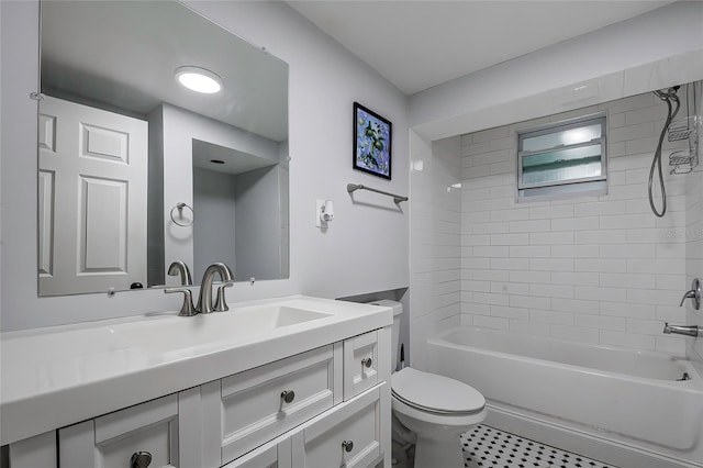 full bathroom with toilet, tiled shower / bath combo, and vanity